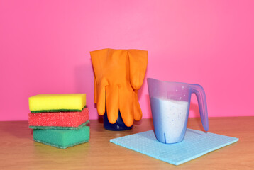 Washing sponge rubber glove and washing powder in a container
