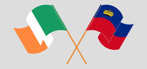 Crossed and waving flags of Ireland and Liechtenstein