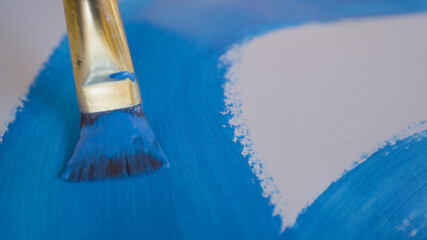 CLOSE UP, DOF: Artist drags their paintbrush across a blank slate of paper. - obrazy, fototapety, plakaty