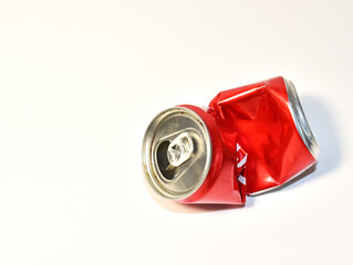 Empty crumpled can from a sweet carbonated drink. Aluminum can trash for disposal and recycling. Сrushed soda cans