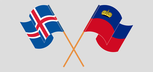 Crossed and waving flags of Iceland and Liechtenstein