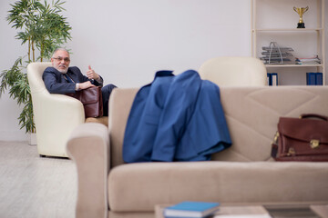 Old businessman employee waiting for business meeting