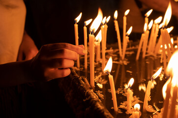 light candles in the church