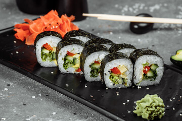 Vegetarian Maki Sushi - Roll made of Tomato, Cucumber, Bell Pepper, Salad Leaf and Japanese Mayonnaise