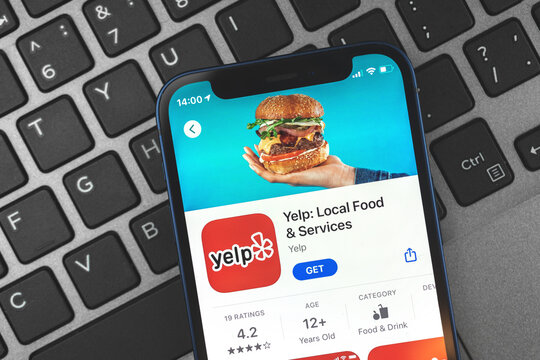 Kharkov, Ukraine - May 28, 2021: Yelp local food and services app icon close-up on the screen of Apple iPhone