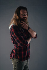 Beautiful strong nordic man with stylish hairstyle and beard on a isolated background.