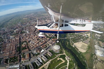 PILOT FLYING OVER THE CITY OF LOGROÑO IN A PLANE