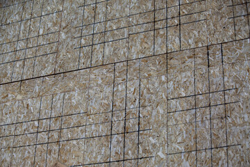 Close-up shot of an engineered wood product called Particle board.