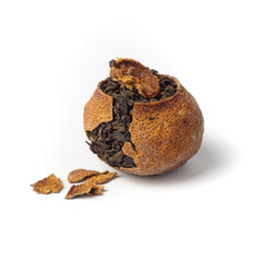 pu-erh tea in tangerine just cracked few pieces of peel isolated left side