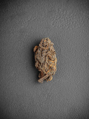 Pu-erh leaves in bud on dark gray background Lao Cha Tou top view