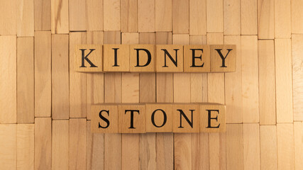 The word kidney stone created from wooden cubes. Health and life