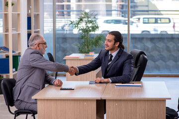 Two businessmen discussing business project