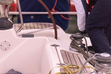 We wind the mooring lines on the winch on the yacht. The sailor throws the aft mooring line when...