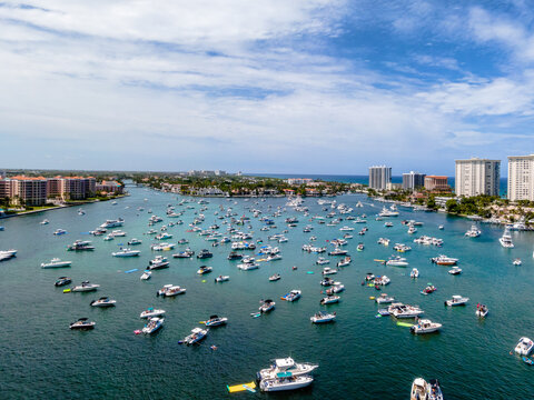 aerial drone of City in Lake Boca Raton, Florida with boats
