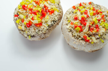 Mushrooms stuffed with onion, garlic, leek, paprika and sprinkled with cheese and breadcrumbs, snack prepared for baking