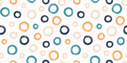 Colorful seamless pattern with rings in brush stroke technique. Vector abstract background with hand painted circles.