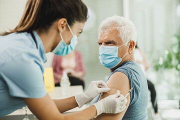 Senior Man Getting Vaccinated Due To Covid-19