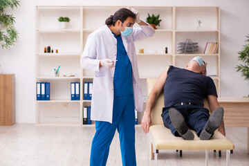 Old man visiting young doctor in covid-19 vaccination concept