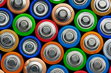 Batteries, top view, used alkaline battery AA size format in row, environmental pollution problem concept, macrophotography 