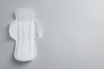 Sanitary napkin on light grey background, top view. Space for text © New Africa