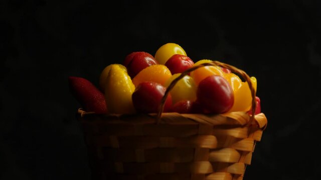 Farmer wicker basket with delicious tomatoes and peppers