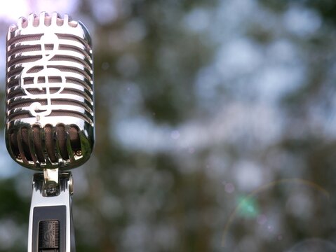 Microphone image used for advertisement. Background is bokeh.
