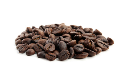 Heap of roasted coffee beans isolated on white