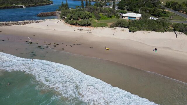 Duranbah Foamy Sea Waves Towards Ebenezer Park In Tweed Heads, New South Wales, Australia. - Low Aerial Shot