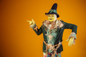 photo of scarecrow character from festa junina on yellow background with space for text - obrazy, fototapety, plakaty