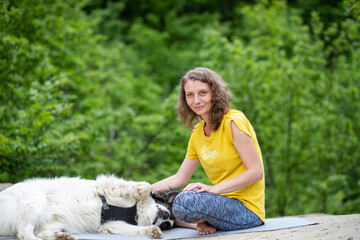 woman with her dog enjoying summer nature