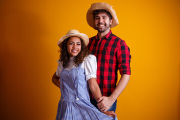 Brazilian couple wearing traditional clothes for Festa Junina - June festival.