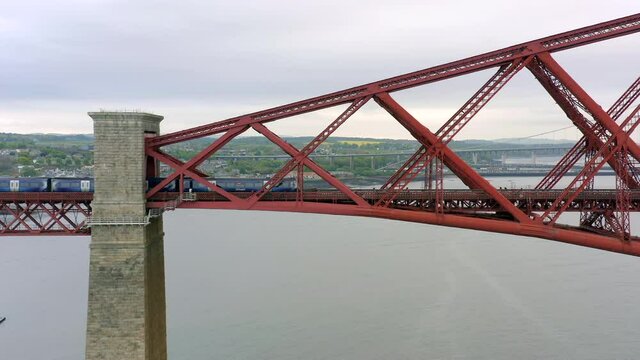 A Commuter Train Crossing a Bridge in Scotland