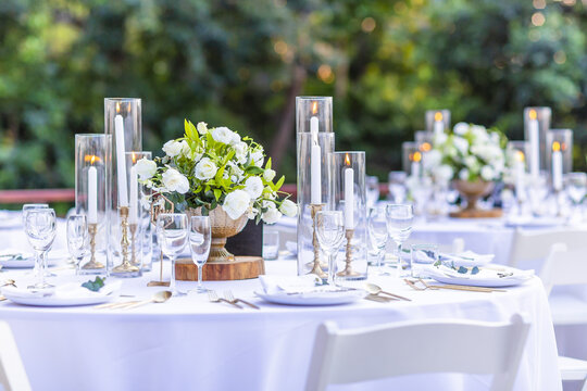 Romantic Wedding Table Top Layout Table Spread No People Tropical Location With Gold Cutlery White Table Cloth And Scenic View Of Sunset With Copy Space Tablescape, Beautiful Paradise Setting