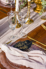 Romantic Wedding Table Top Layout Table Spread no people no human tropical location with gold cutlery and scenic view