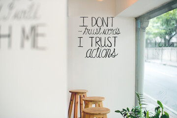 I don't trust words, I trust actions typography on the wall