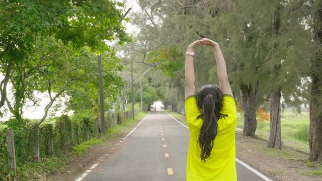 Young  woman streaching before active exercise
