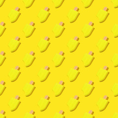 Seamless pattern of yellow ice cream on a yellow background.