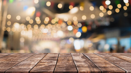 Empty wood table top and blurred coffee shop and restaurant interior background - can used for...