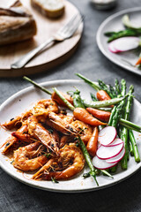 Garlic and Herby Prawn with Sautéed Asparagus, Baby Carrot and Snap pea