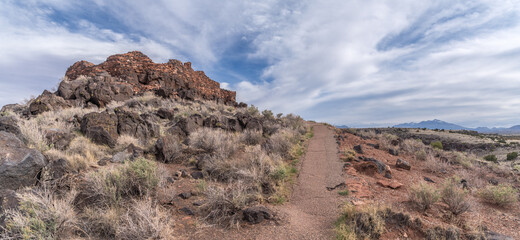 Fototapeta premium Wupatki Citadel National Monument located in north-central Arizona, . Native American archaeological hilltop dwelling sites made from red stone built by ancient Sinagua pueblo people, blue sky