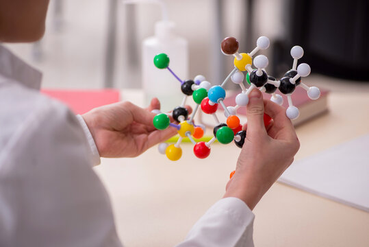 Schoolboy studying chemistry in the classroom - Powered by Adobe