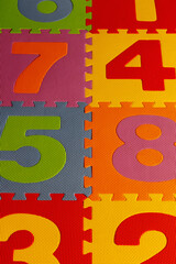 Bright colored rubber kids puzzle mat with numbers.