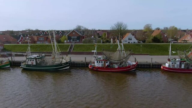 Drone flight over a tranquil and idyllic fishing port in germany