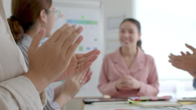 Small group asia female young happy people, sale team work in reskill upskill training class share plan idea in project research job feel bonding thankful respect greeting smile sit in office room.