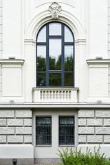 building facade large semicircular arched wooden window