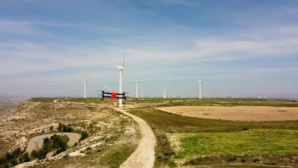 Aerial view of a Drone preparing for Windmills Inspection