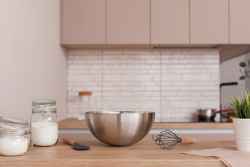 Concept of vegetarian baking background in modern home kitchen interior in light colors. Ingredients for cooking: rice flour, coconut milk, coconut palm sugar.