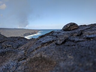 Fototapeta na wymiar rocks in the sea next to volcano