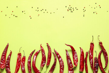 Hot chili peppers on color background