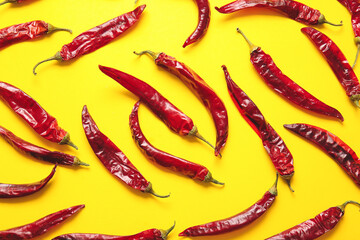 Dry hot chili peppers on color background
